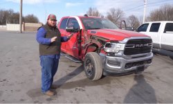 Westen Champlin and his wrecked Cummins-powered 2019 Ram 2500 Big Horn. (Westen Champlin) (1).jpg