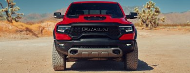 2021-Ram-TRX-pickup-truck-model-exterior-front-shot-of-grille-and-headlights-with-red-paint-co...jpg